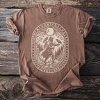 Brown t-shirt with oval rune border around traveler with two ravens.