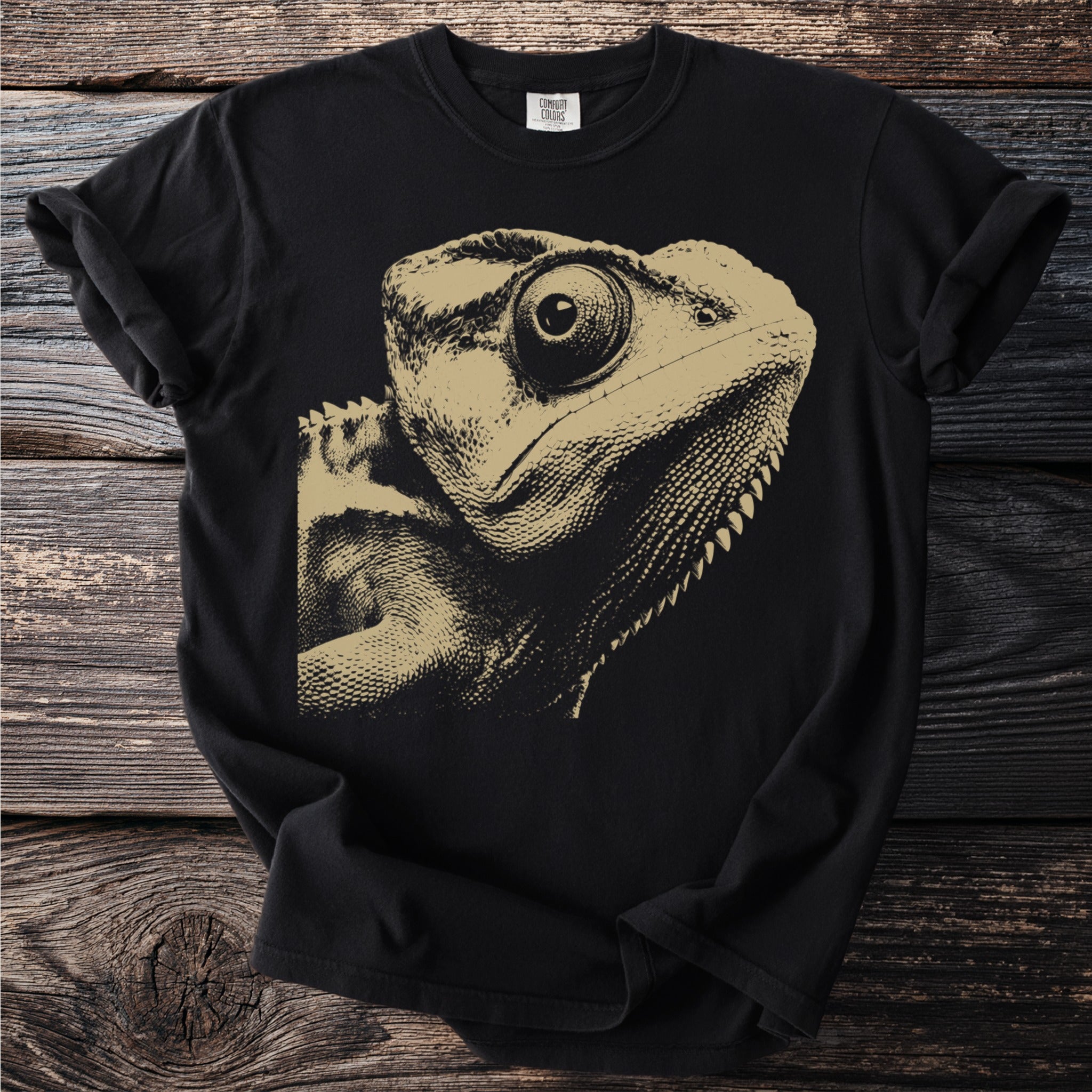 Black t-shirt with a close-up, gold-toned lizard graphic on the front.