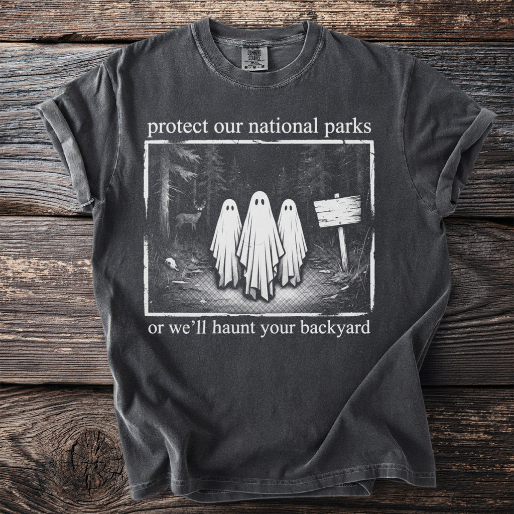 T-shirt with print: "protect our national parks or we'll haunt your backyard".