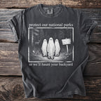 T-shirt with print: "protect our national parks or we'll haunt your backyard".