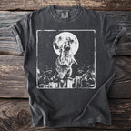 Dark t-shirt with a black and white graphic of a raccoon howling at the full moon.