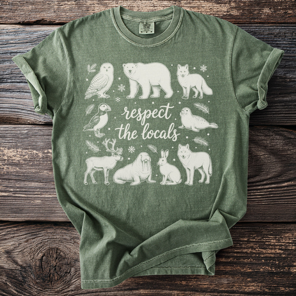 Green t-shirt with line drawing of arctic animals and "respect the locals" text.