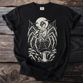 Black t-shirt with spider web design featuring a woman playing a lute.
