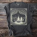 Dark grey t-shirt with a cream linocut design of woodland creatures around a campfire.