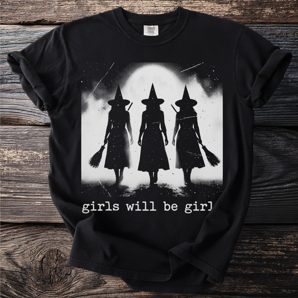 Black t-shirt with three witch silhouettes holding brooms under a full moon and text "girls will be girl".