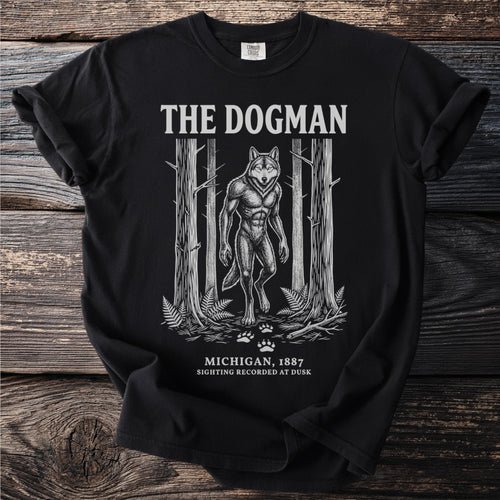 Black t-shirt featuring "The Dogman" text with a werewolf in a forest.