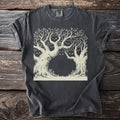 T-shirt with a faded black distressed look featuring a light brown line drawing of trees with hidden cat faces.