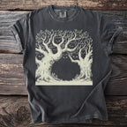 T-shirt with a faded black distressed look featuring a light brown line drawing of trees with hidden cat faces.