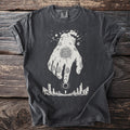 Dark gray t-shirt with white graphic of a hand reaching down to a figure and sun.