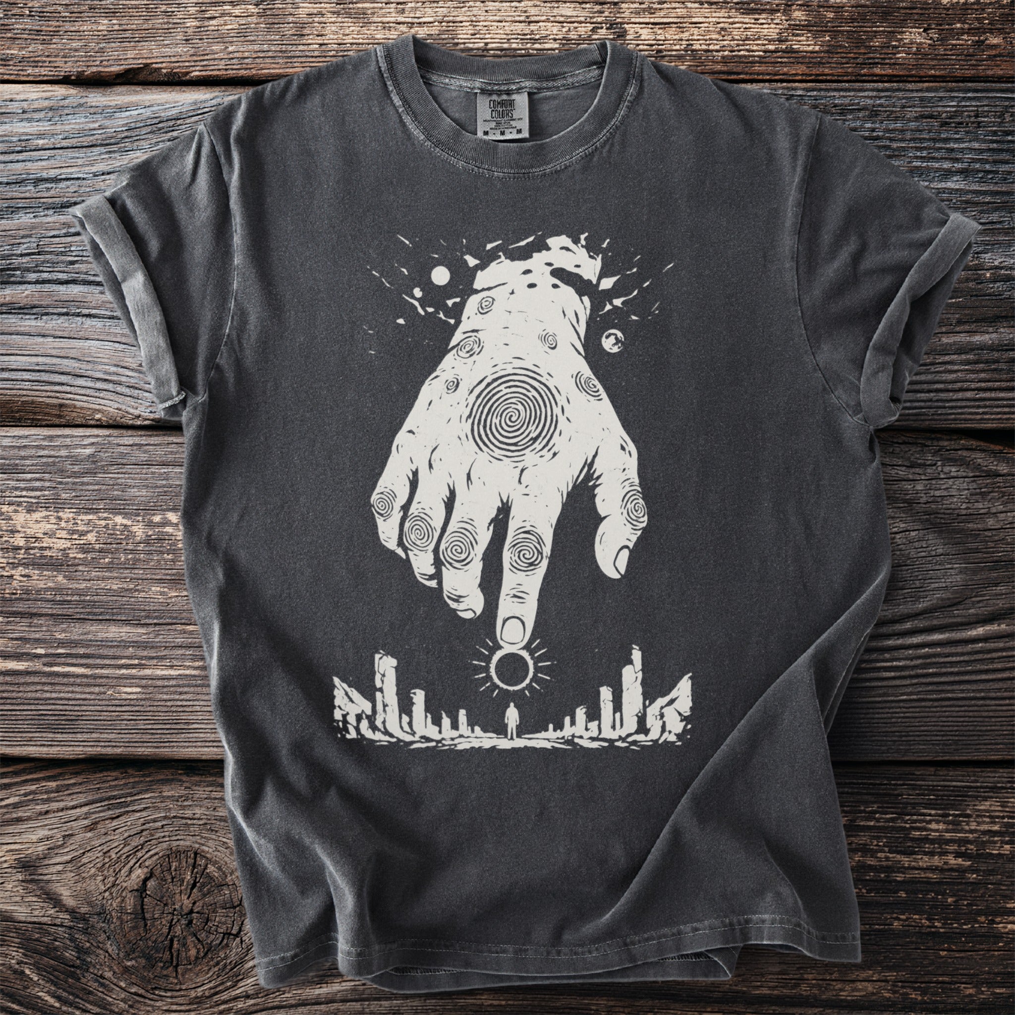 Dark gray t-shirt with white graphic of a hand reaching down to a figure and sun.