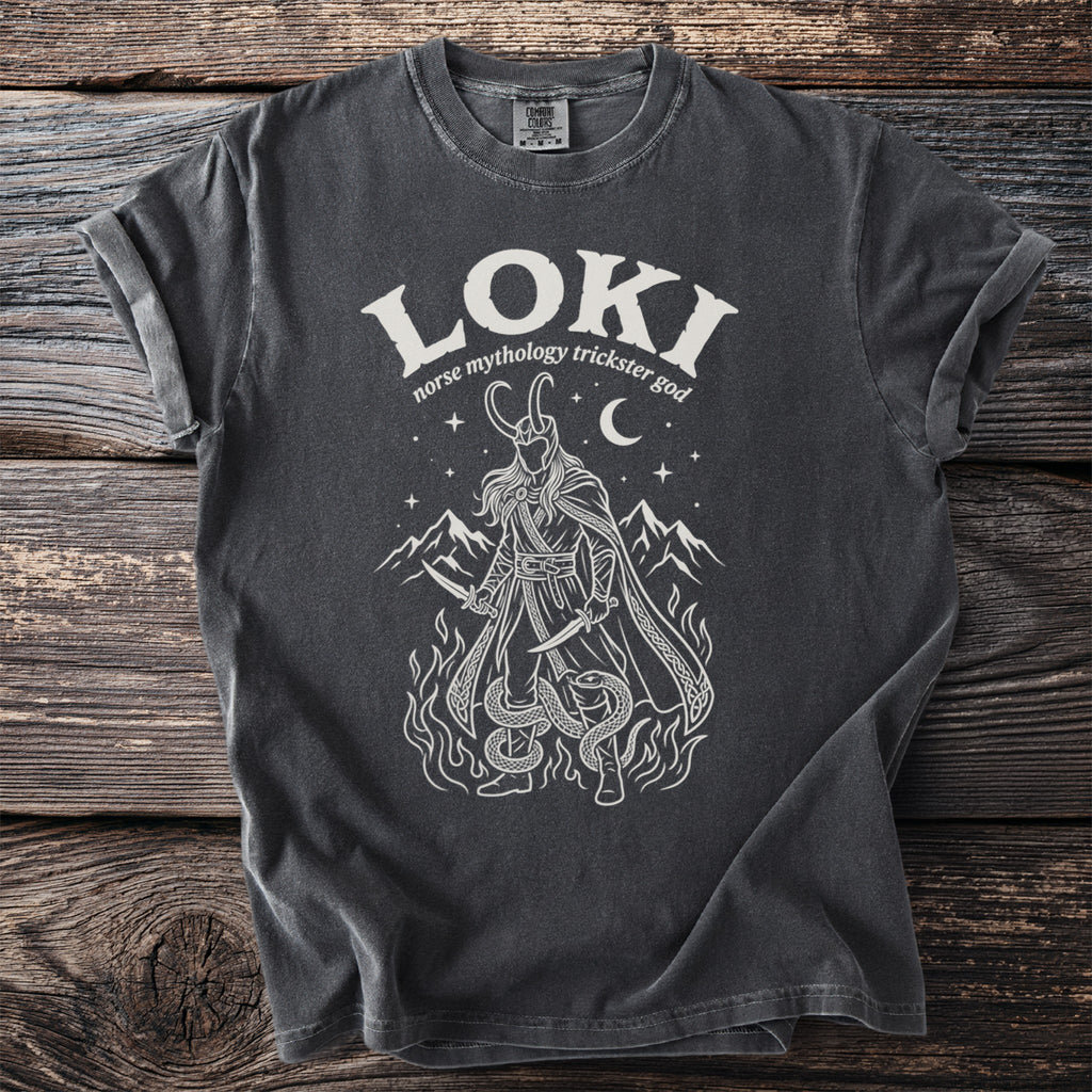 Dark grey t-shirt with white graphic of Loki, mountains and snakes.