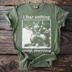Green t-shirt with a werewolf and mouse graphic, reads "i fear nothing except everything".