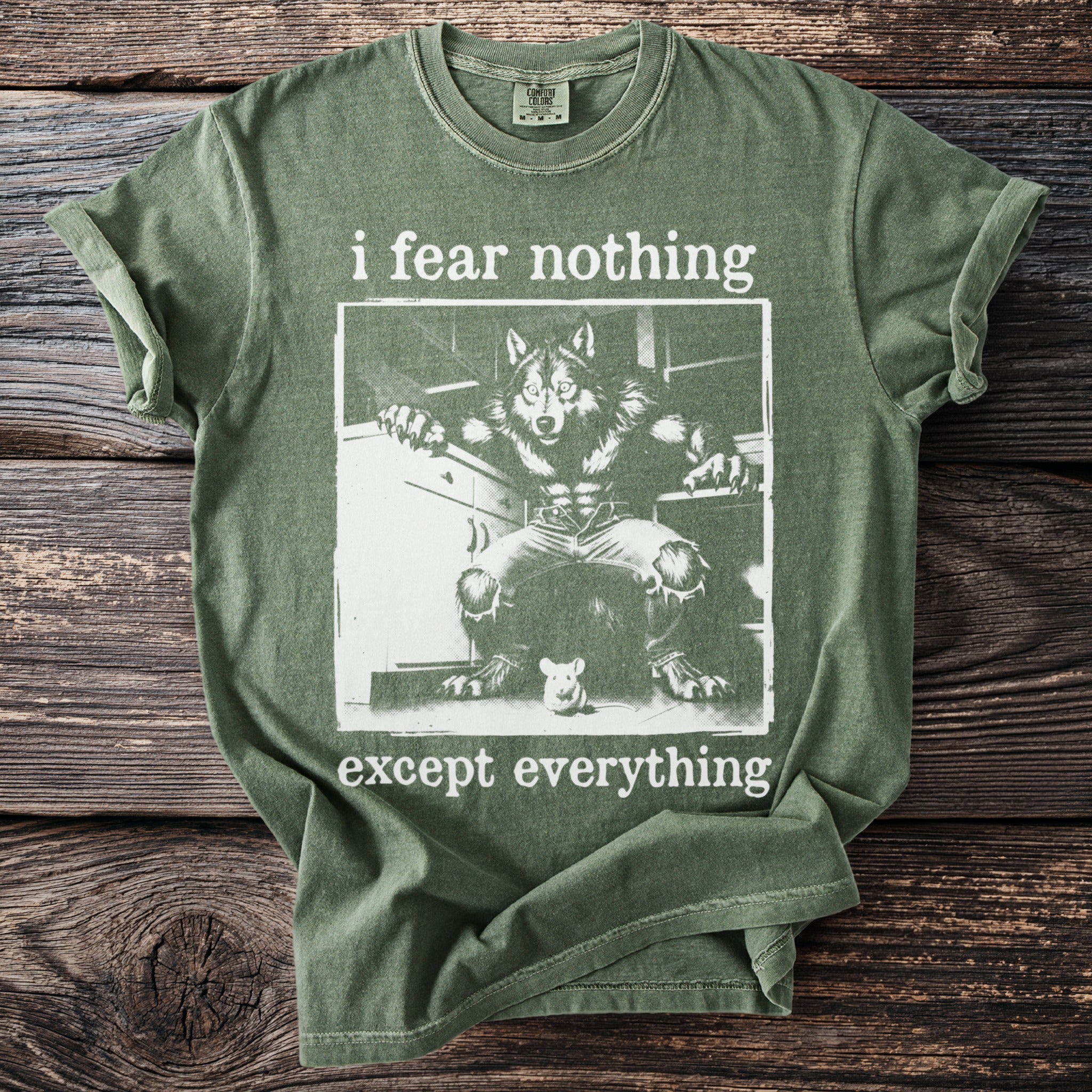 Green t-shirt with a werewolf and mouse graphic, reads "i fear nothing except everything".
