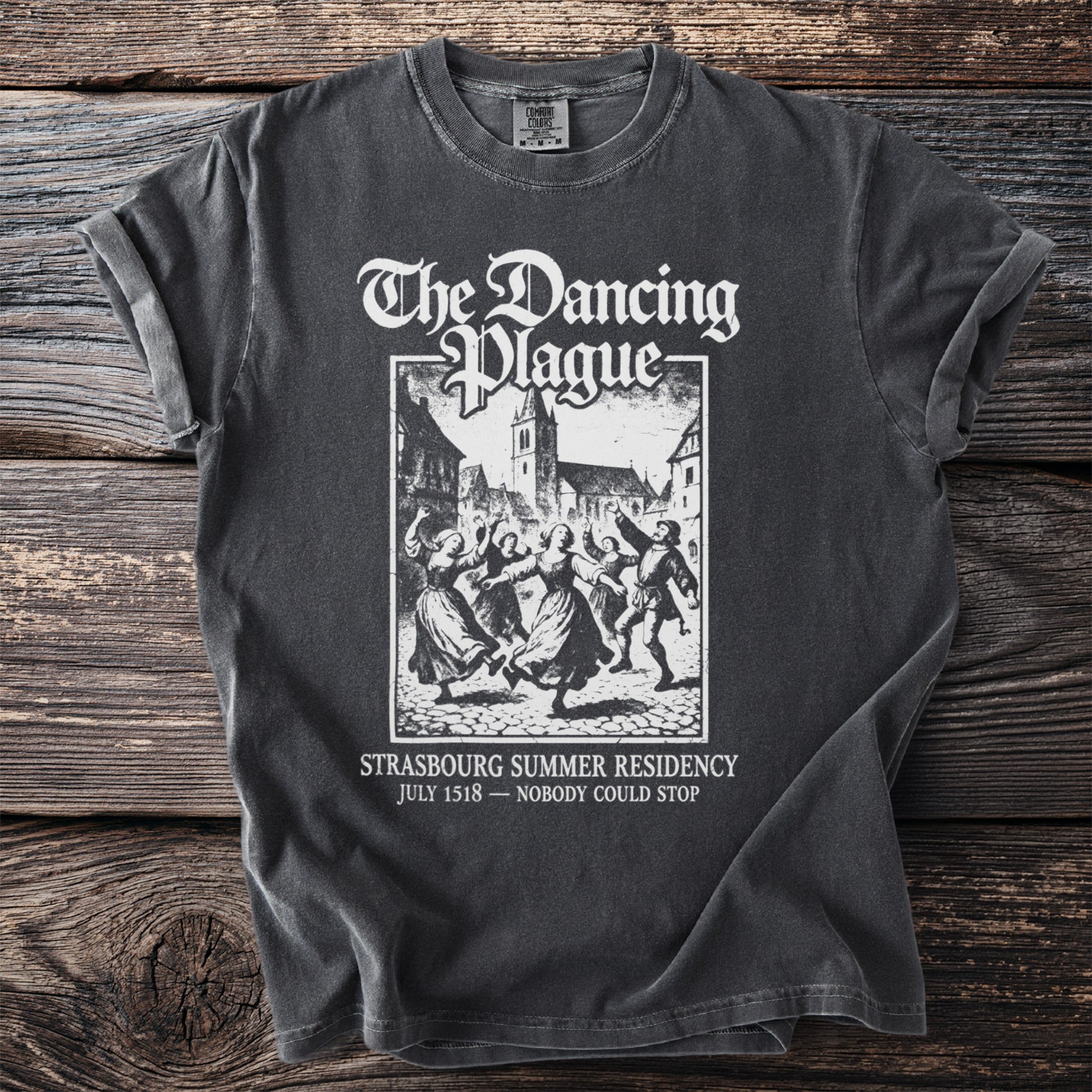 Dark grey t-shirt with white graphic: "The Dancing Plague", Strasbourg Summer Residency, July 1518.