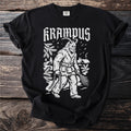 Black t-shirt with white graphic of Krampus holding chains and birch branches.