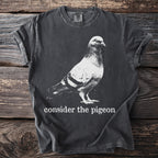 Dark grey t-shirt with "consider the pigeon" text and a pigeon graphic.