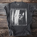 T-shirt with text "please do not perceive me" and a black cat peeking behind curtains.