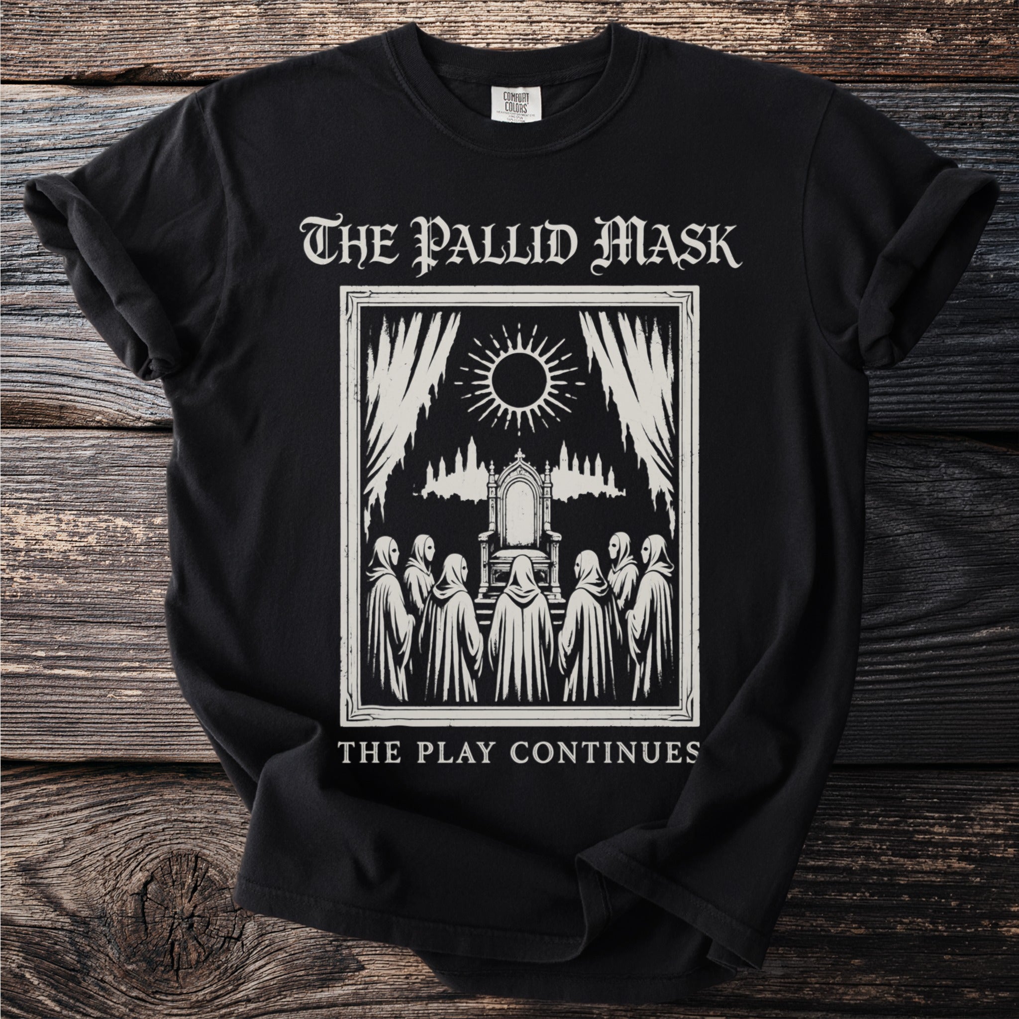 Black t-shirt with "The Pallid Mask" and "The Play Continues" text and a graphic.