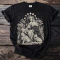 Black t-shirt with a line art print of a woman with cats, flowers, moon phases, and stars.
