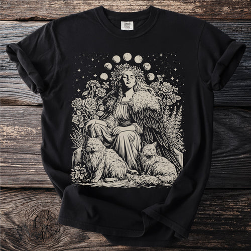 Black t-shirt with a line art print of a woman with cats, flowers, moon phases, and stars.