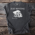 Dark t-shirt with "JUST RENTING" text and a hermit crab labeled "Fig. 1: Borrowed Property."
