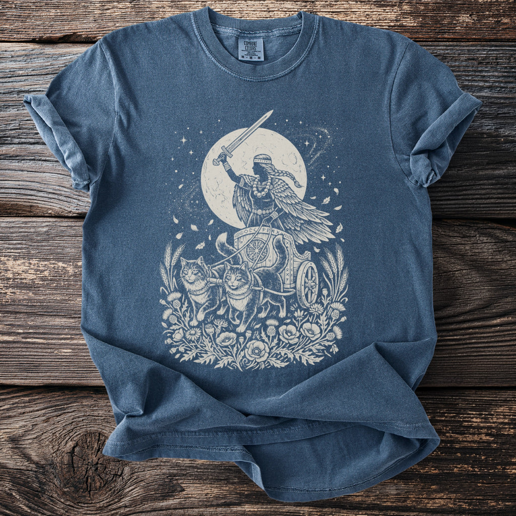 Celestial goddess riding a chariot pulled by cats, with sword raised against a moonlit sky.