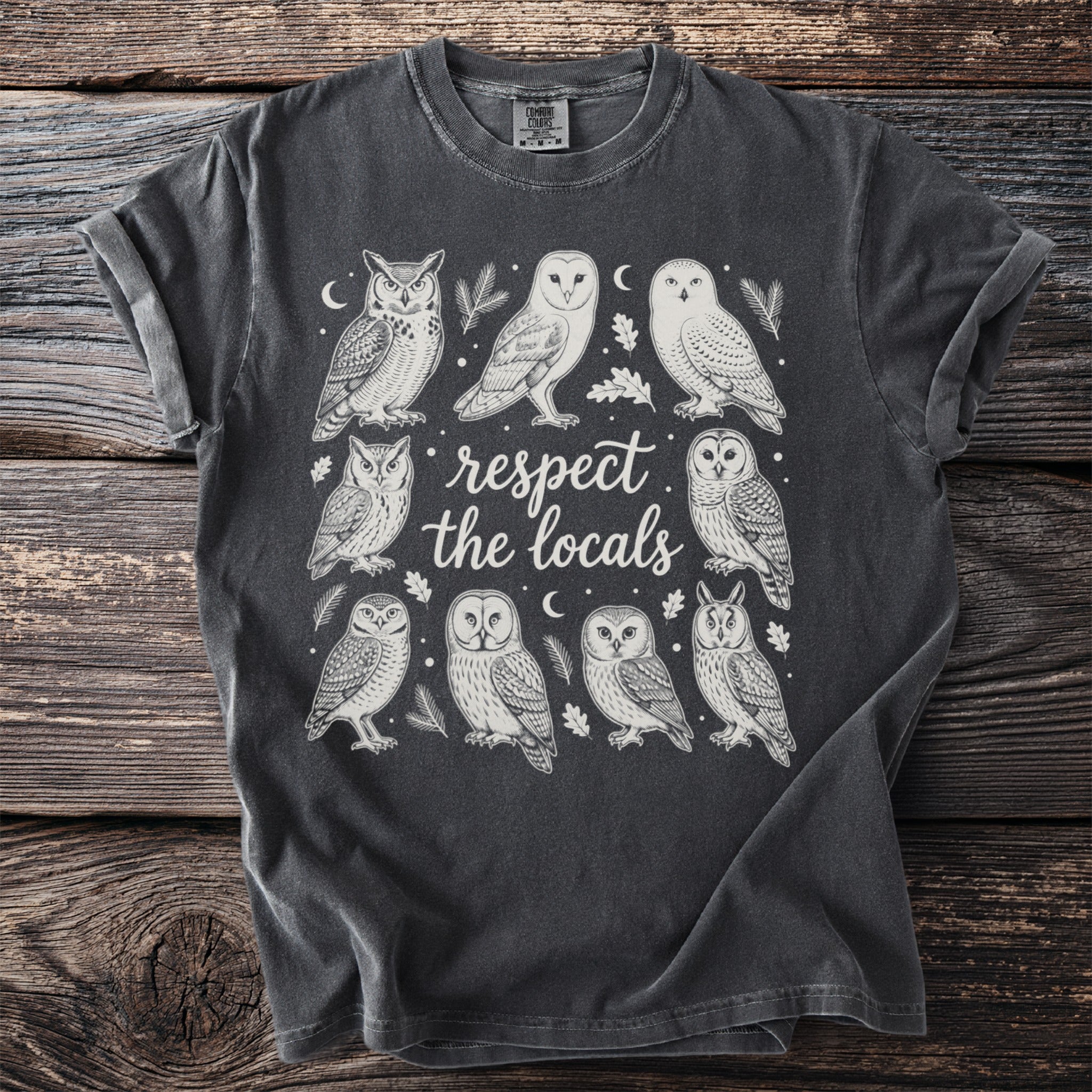 Dark gray t-shirt with white graphic of eight owls and "respect the locals" text.