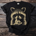Black t-shirt with a tan graphic of a raccoon eating pizza.