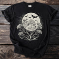 Black t-shirt with moon, bats, and flowering branches graphic.