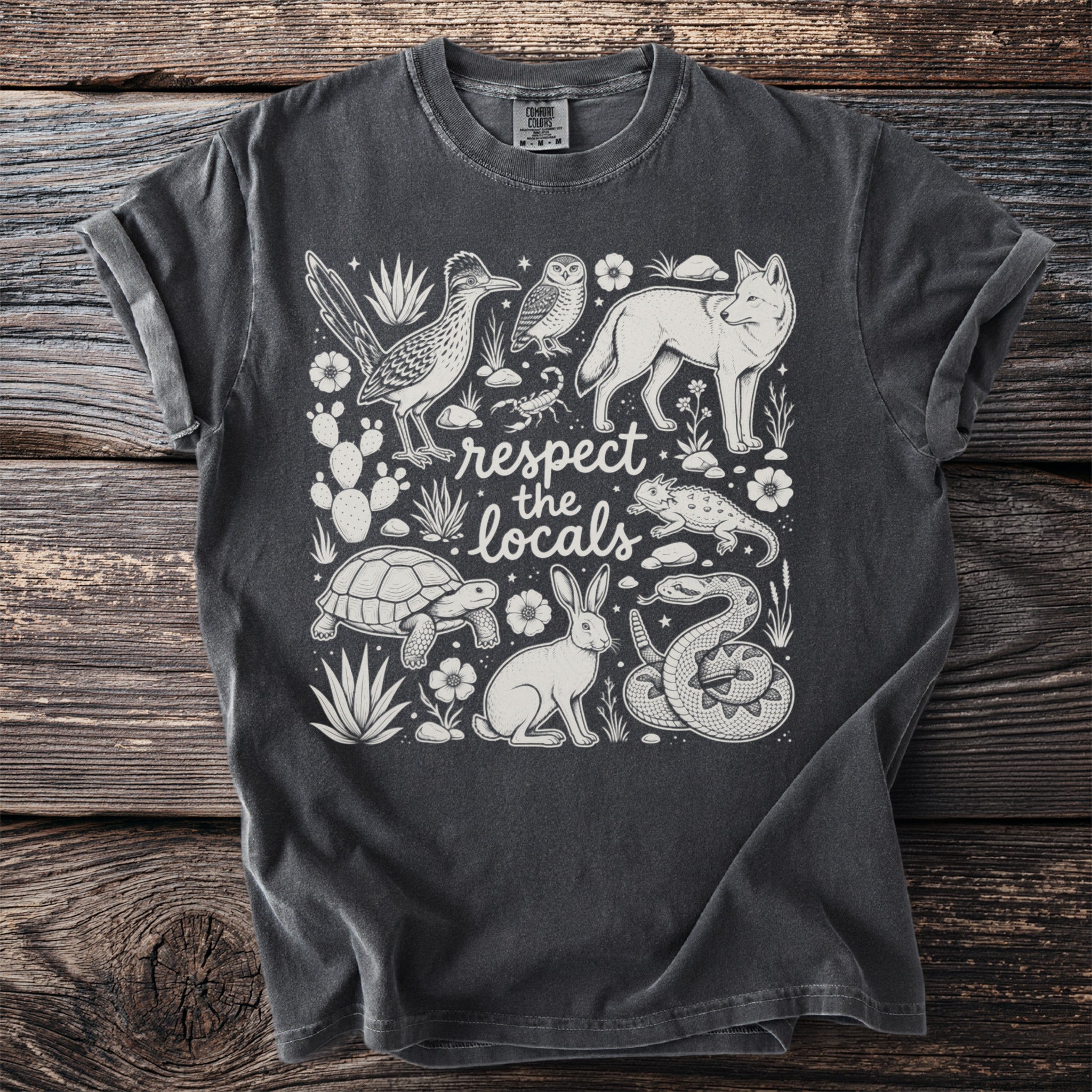 T-shirt with desert animals and "respect the locals" text.