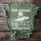 Green t-shirt with white graphic of possum holding a trout and text "fish around and find trout".