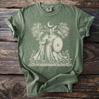 Green t-shirt with Norse warrior, ravens, crescent moon, and trees graphic.