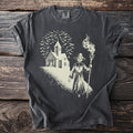 Dark t-shirt with a sketch of a skeleton cloaked figure holding a flaming torch before a church and flock of bats.