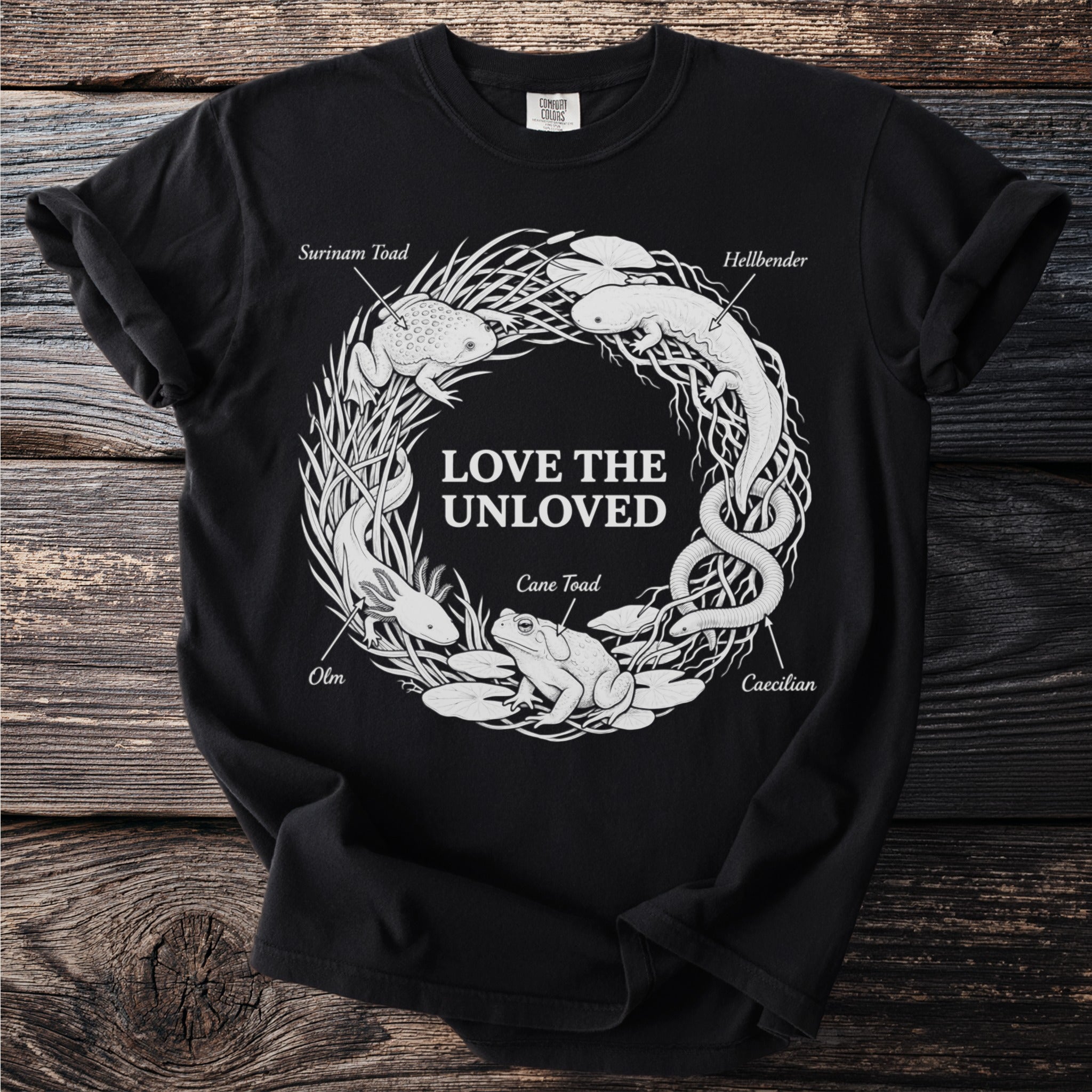 Black t-shirt with "LOVE THE UNLOVED" and outlined illustrations of various amphibians.