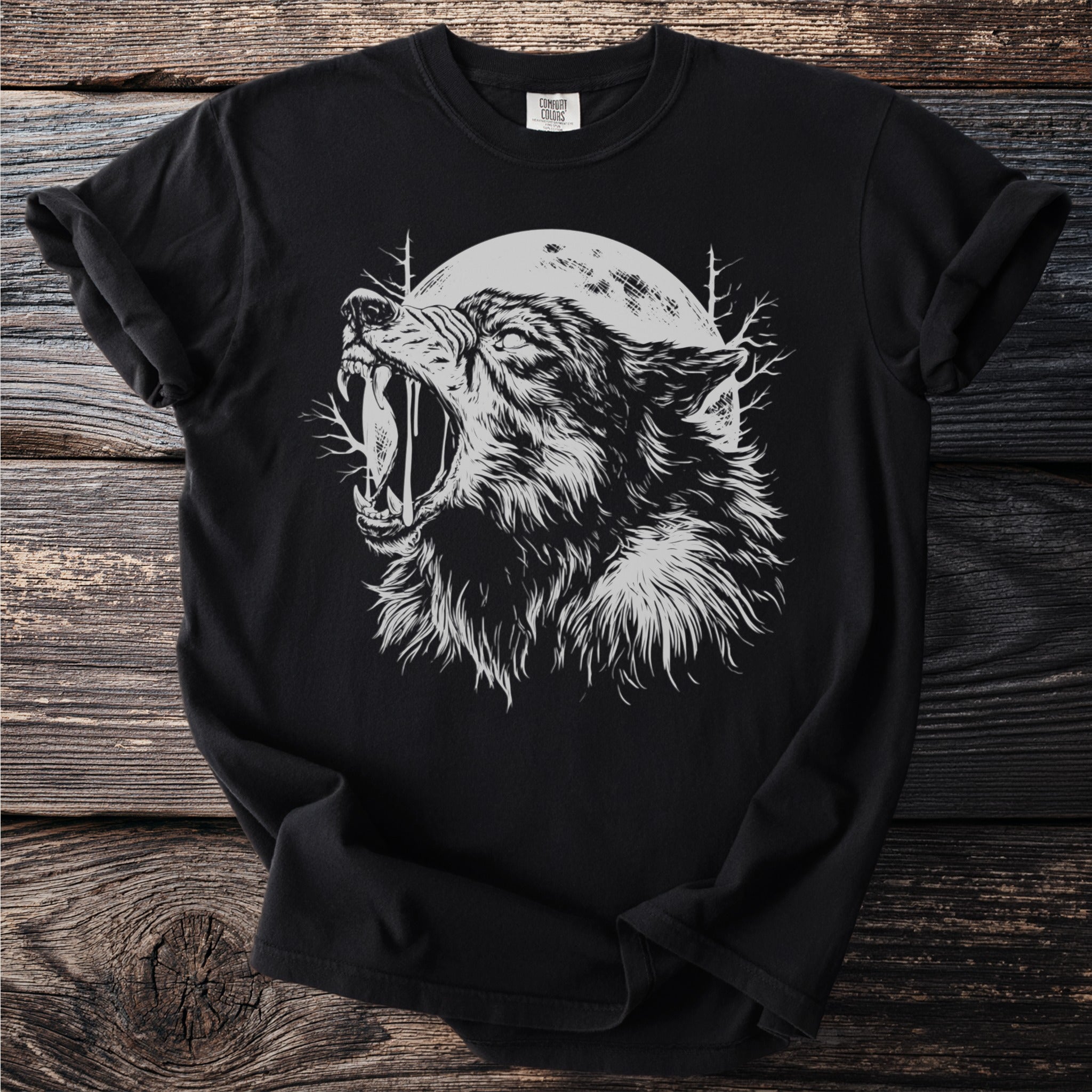 Black t-shirt with a white graphic of a snarling wolf against a full moon.