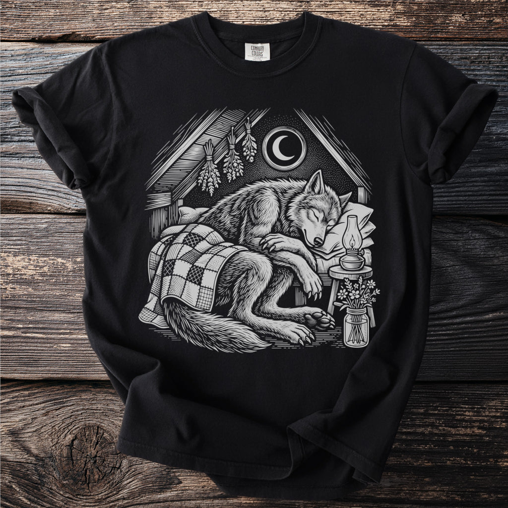 Black t-shirt with a sleeping wolf illustration under a crescent moon.