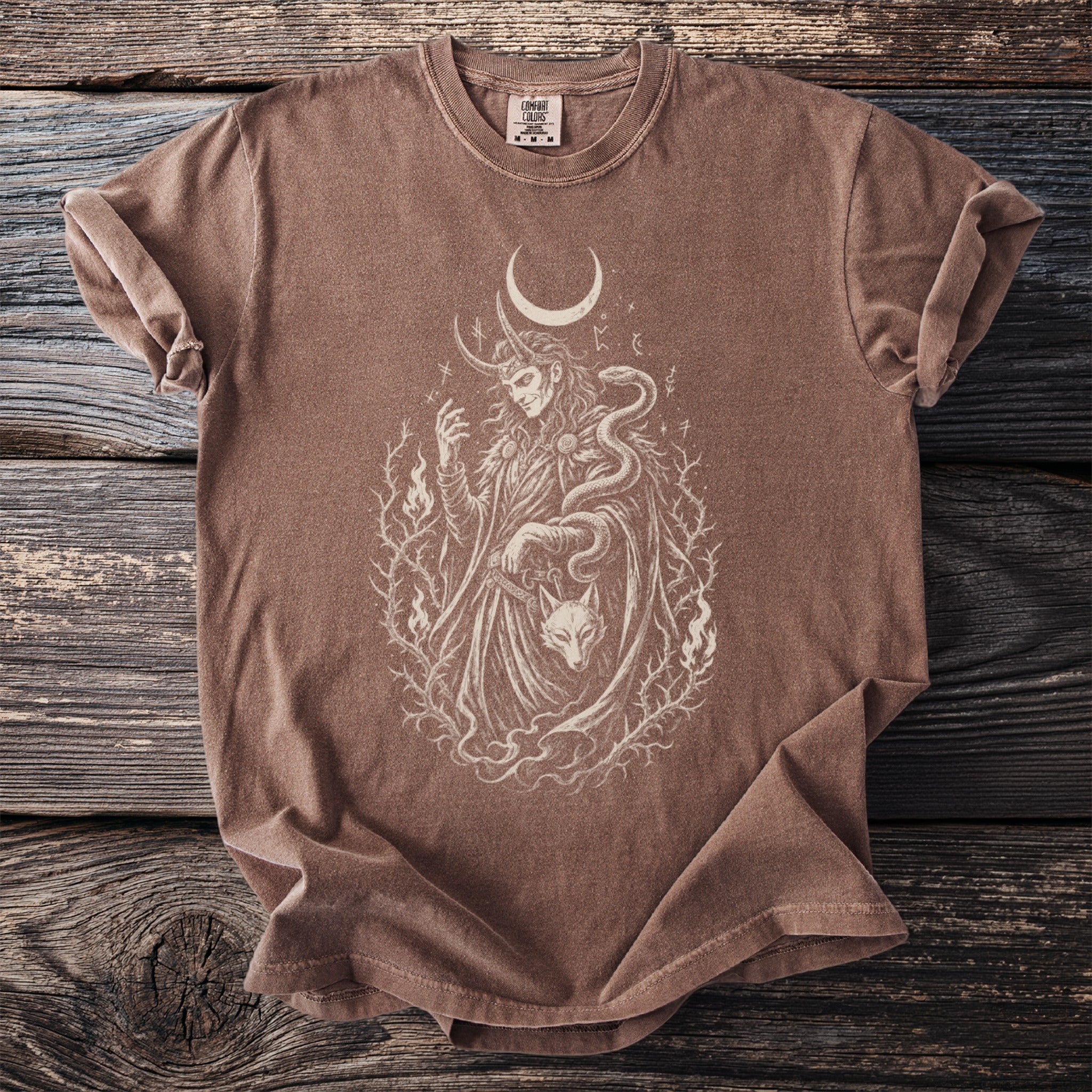 Brown t-shirt with a light graphic of Loki, snake, and wolf head.