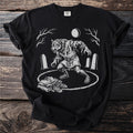Werewolf transforming in a graveyard under a full moon, with clothes and shoes on the ground.