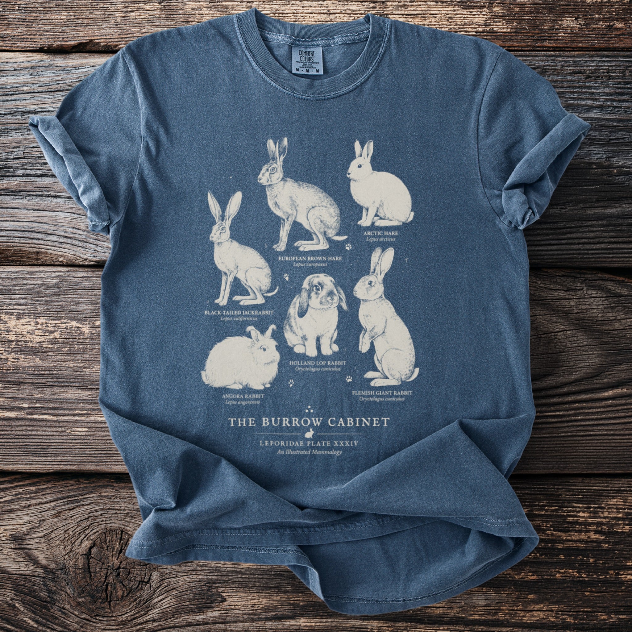 T-shirt with illustrations of various rabbits and hares and text "The Burrow Cabinet".