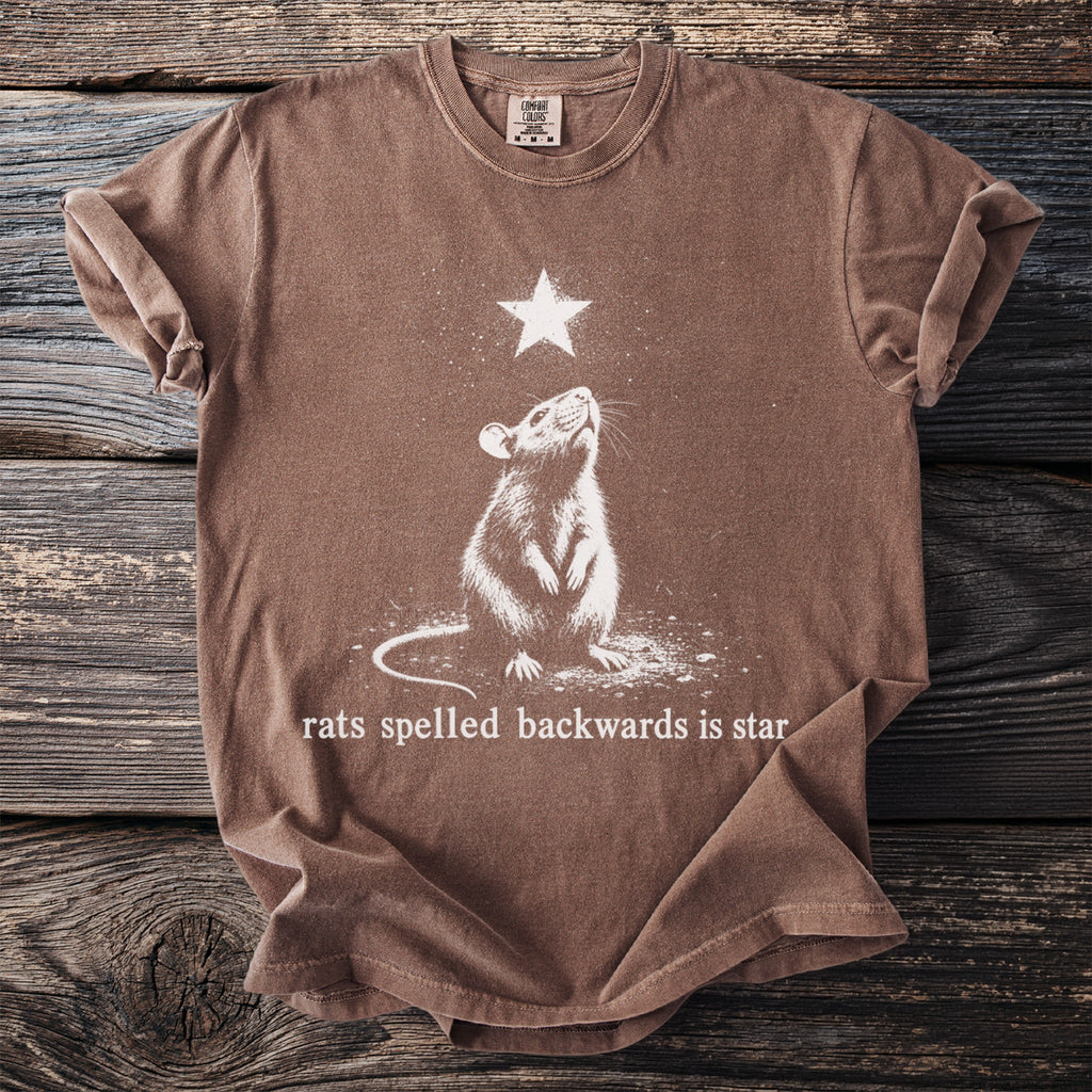 Brown t-shirt with a graphic of a rat looking up at a star, text reads "rats spelled backwards is star".