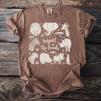 Brown t-shirt with white outline drawings of African animals and text "respect the locals".