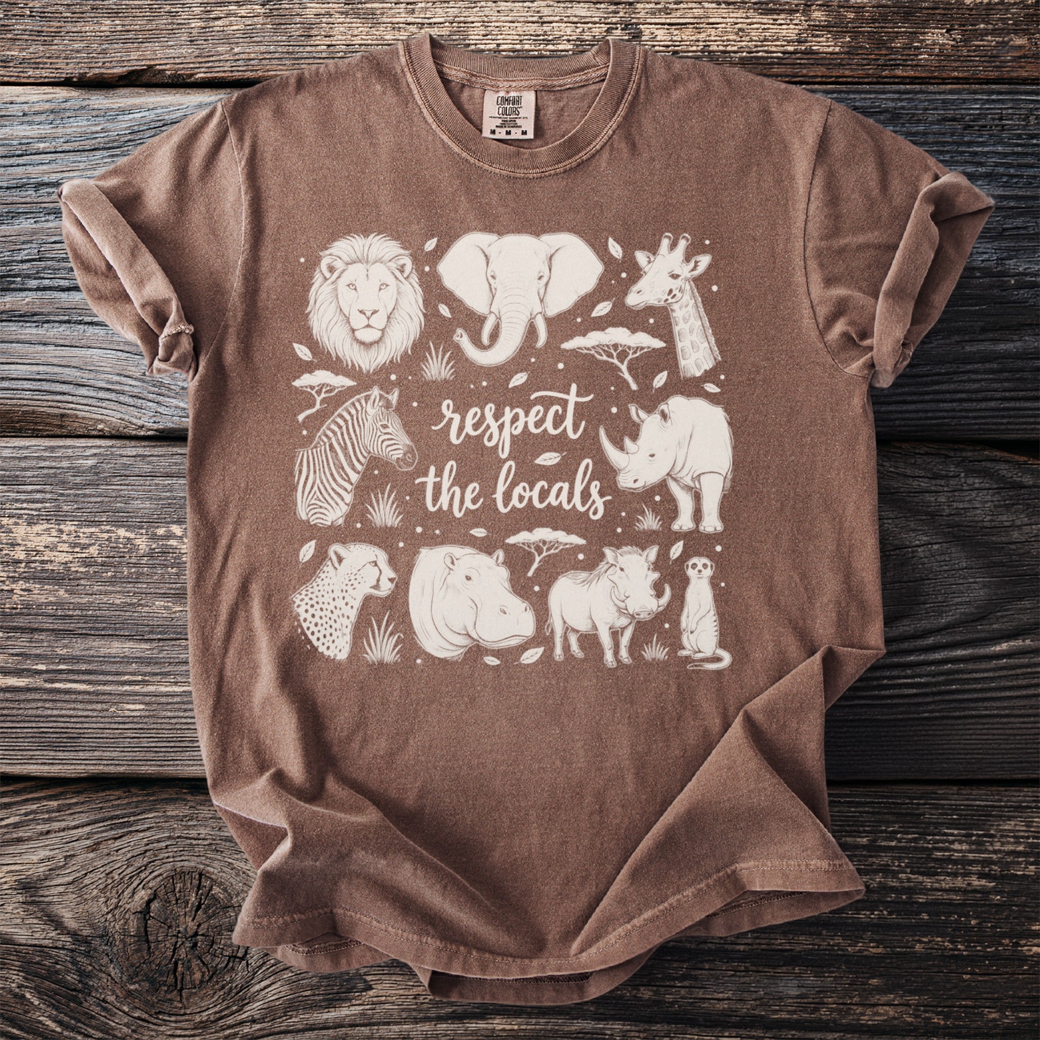 Brown t-shirt with white outline drawings of African animals and text "respect the locals".