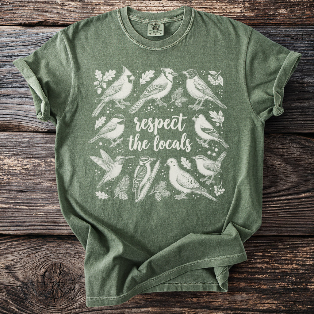 Green t-shirt with various birds and text "respect the locals".