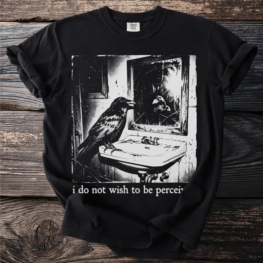 Black t-shirt with graphic of raven at sink and "i do not wish to be percei" text.