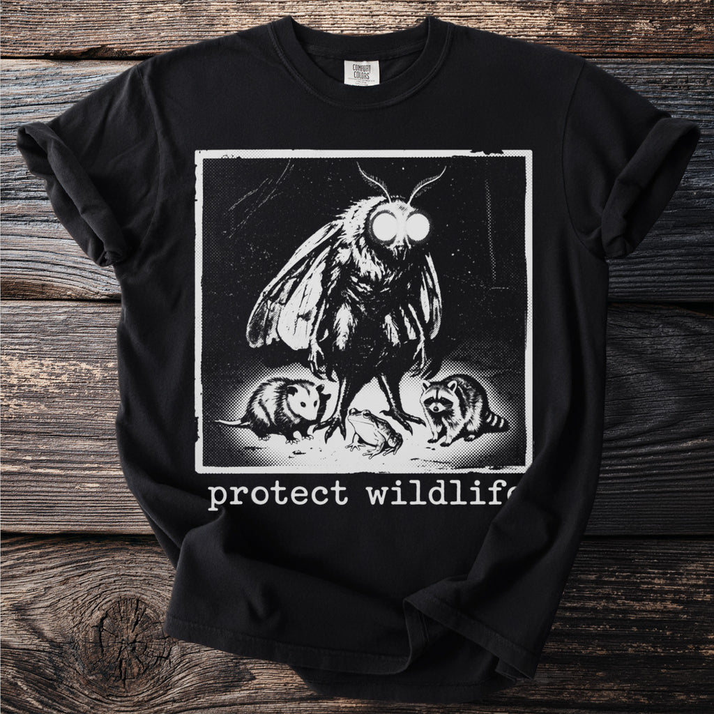 T-shirt graphic featuring a moth, raccoon, opossum, and frog with text "protect wildlife".