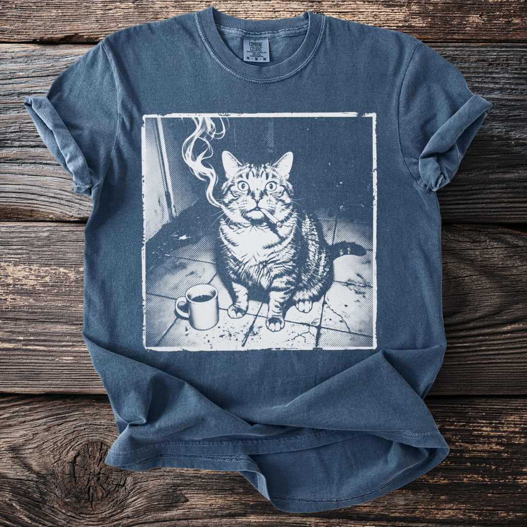 Blue t-shirt with print of a cat smoking with a coffee cup.
