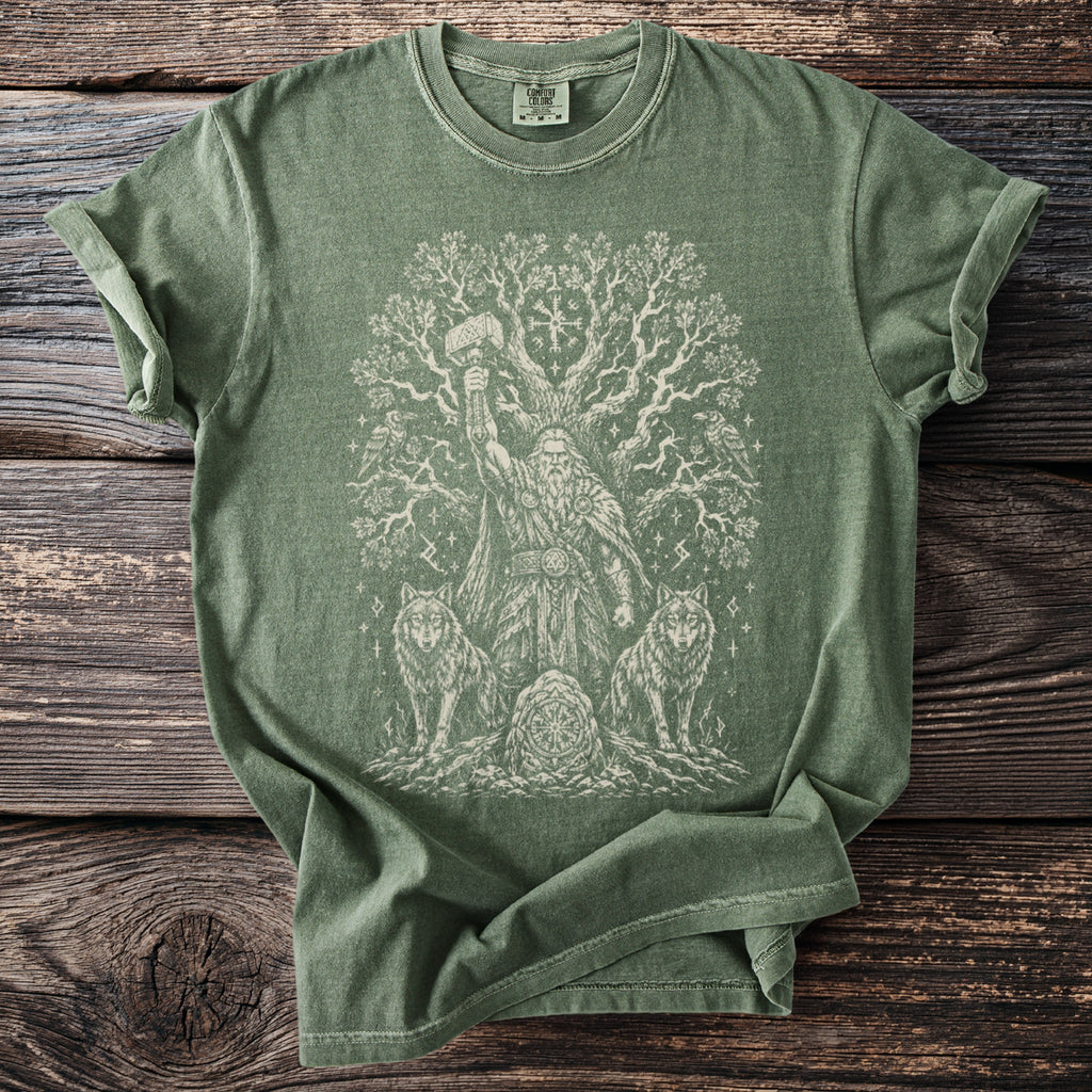 Green t-shirt with a white Odin, wolves, tree, and Thor's hammer design.
