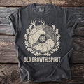 Dark gray t-shirt with deer, boar, snowflake, and oak leaf wreath graphic and "OLD GROWTH SPIRIT" text.