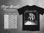 Black t-shirt with size chart and graphic of a werewolf with text "take your time".