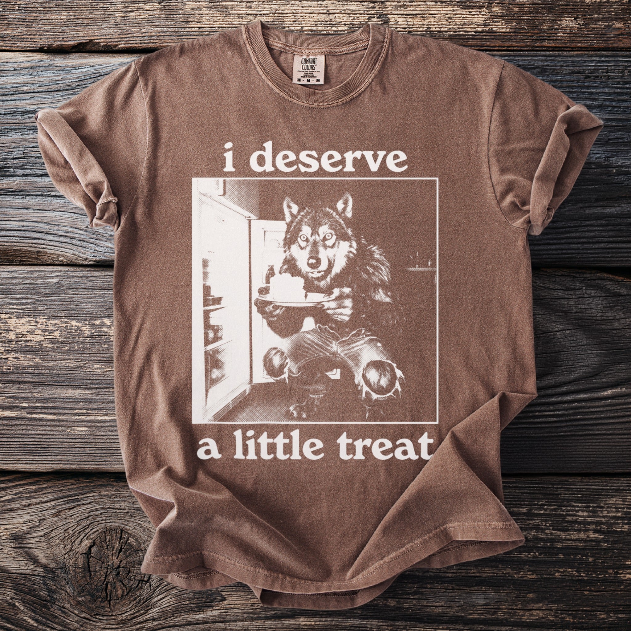 Brown t-shirt with "i deserve a little treat" text and wolf graphic.